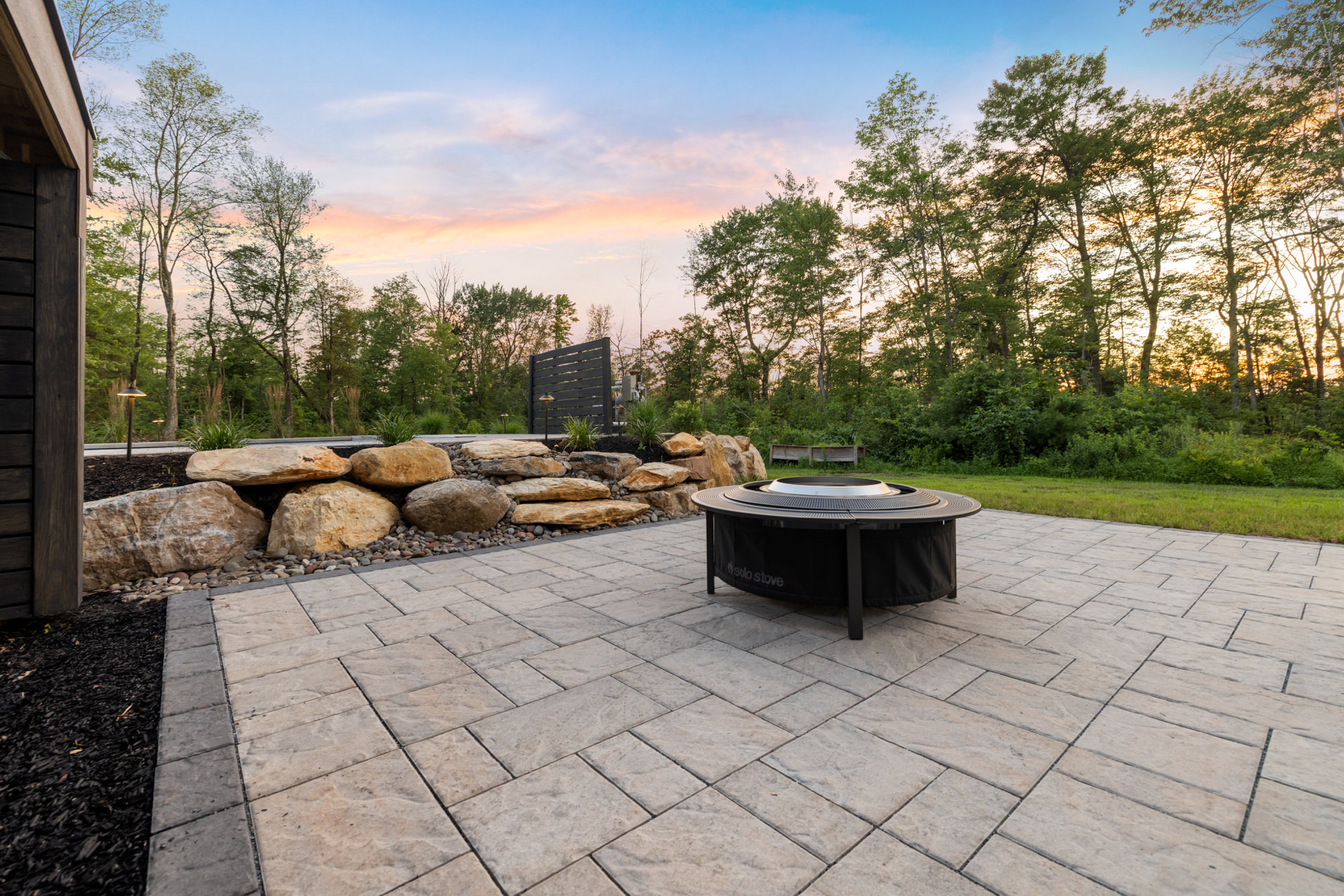 Multi-tier hardscape with boulder walls in Green Lane, PA