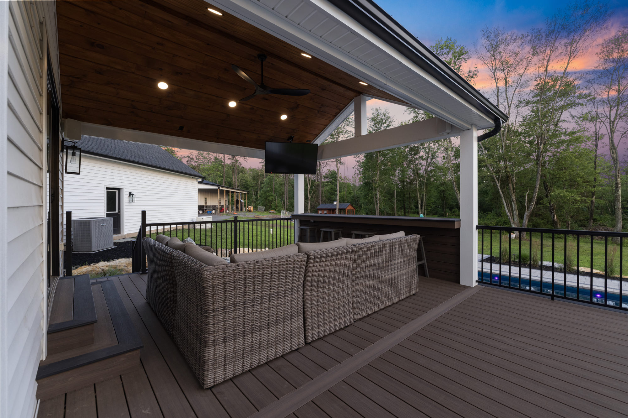 Multi-tiered hardscape patio with boulder walls